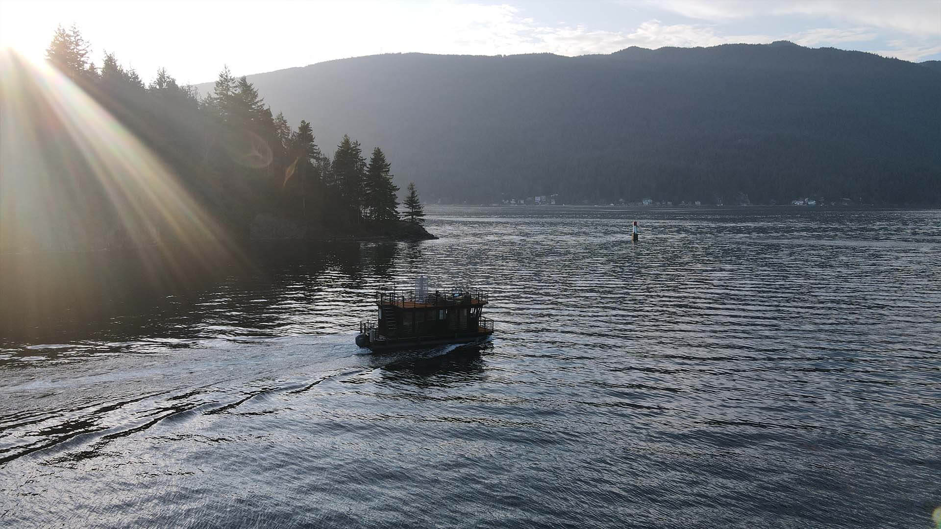 Sauna boat driving in front of sunset