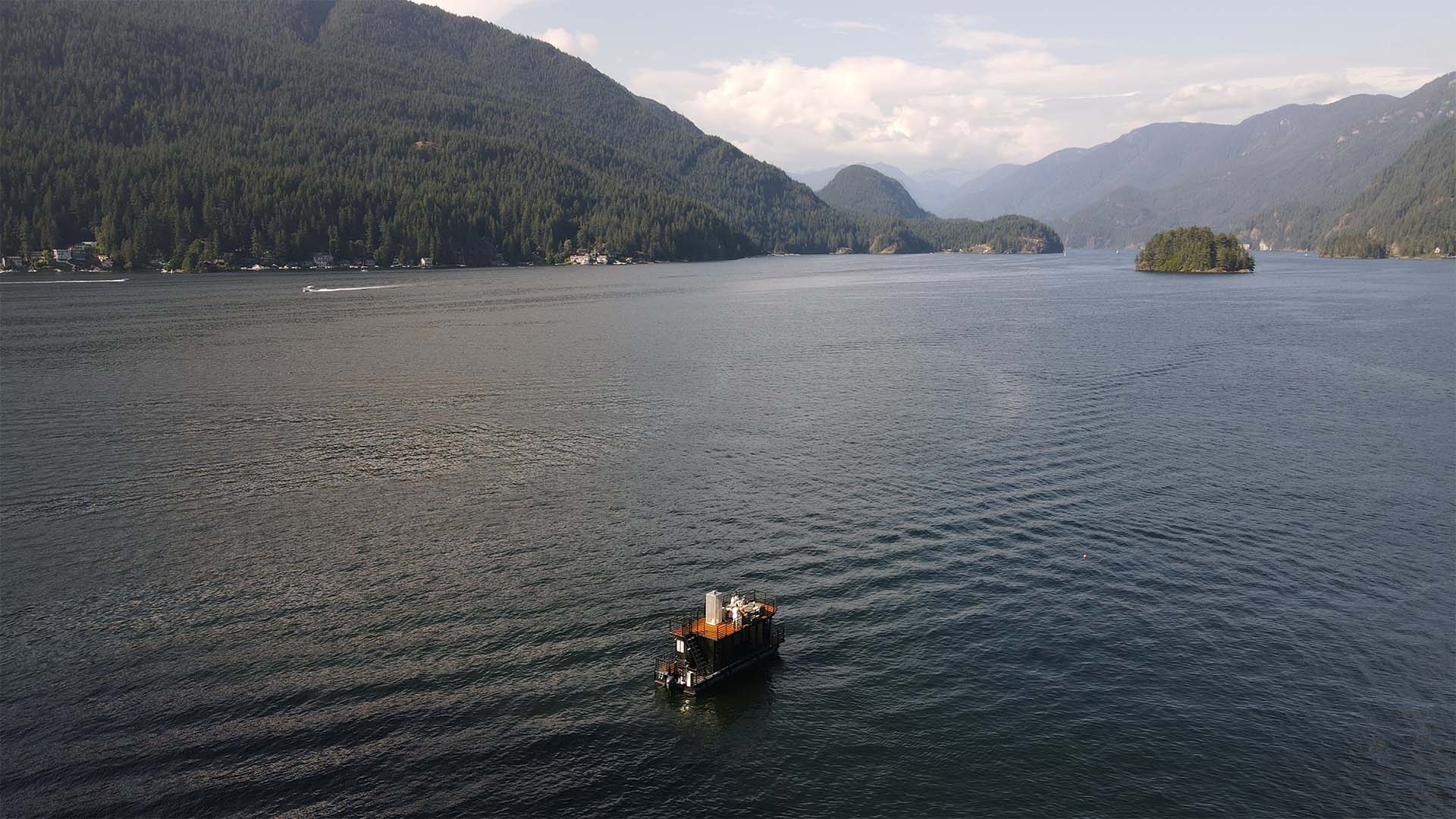 Sauna boat in front of Indian Arm Landscape