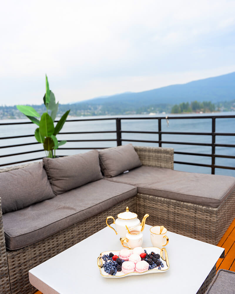 Comfortable outdoor seating on the rooftop deck of the Hot Voyage sauna boat.