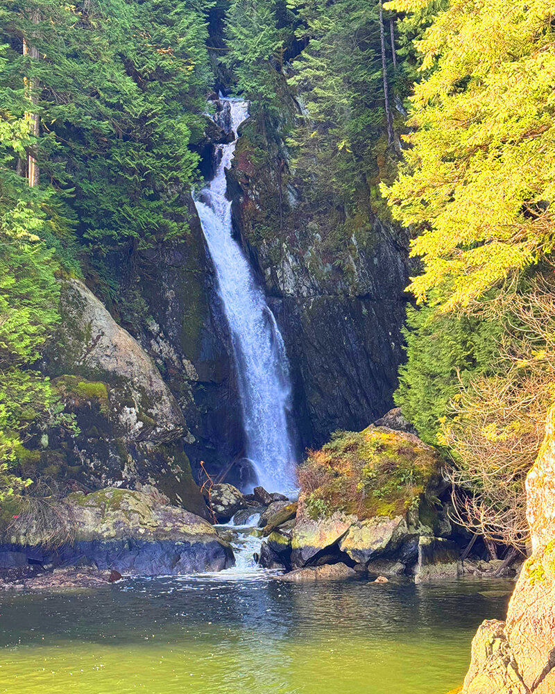 Silver Falls waterfall viewed from a distance from the Hot Voyage sauna boat.