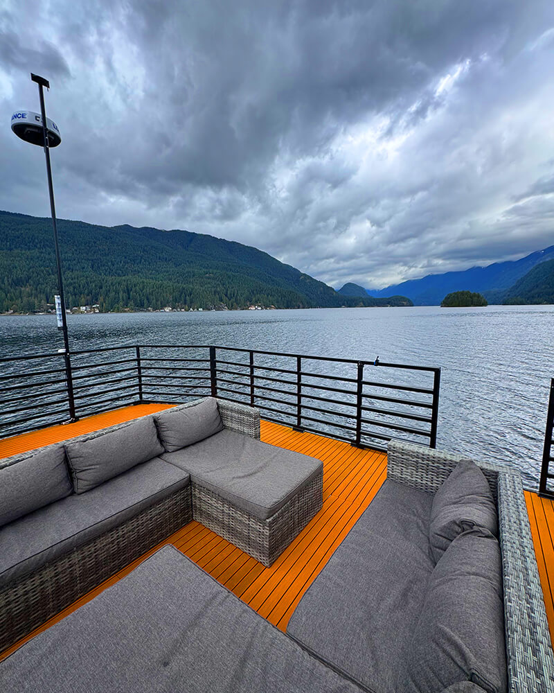 Rooftop deck of the Hot Voyage sauna boat on a cloudy day.